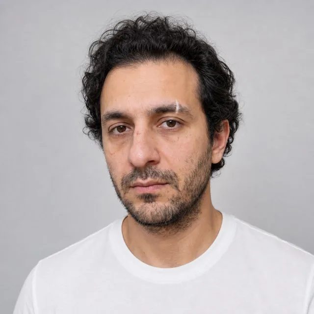 Korean profile: a clean studio profile photo on a pale grey background, soft even beauty lighting, simple white shirt