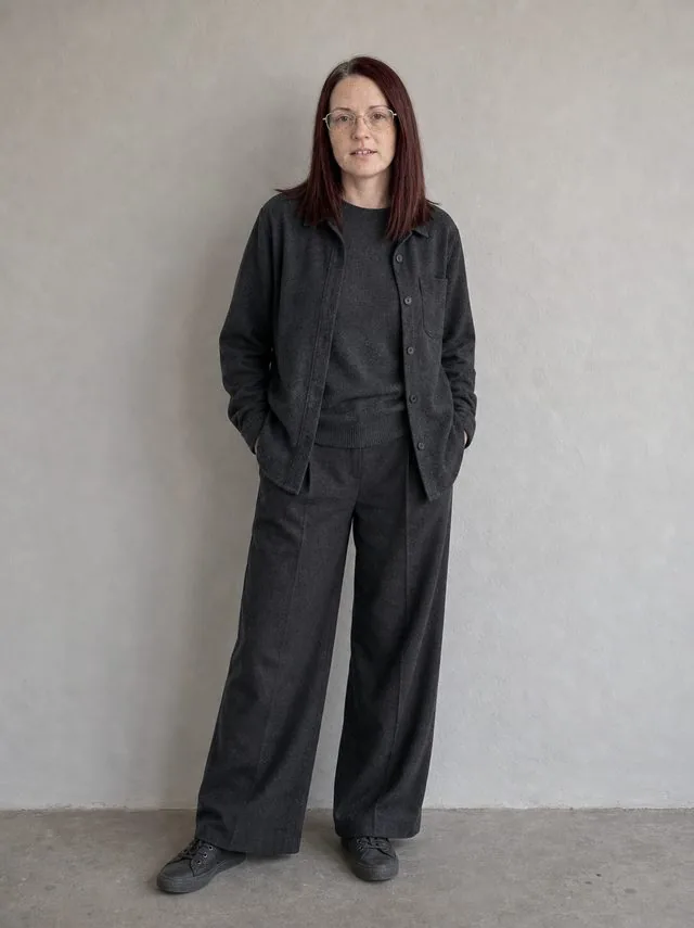 Monochrome layers: a full-length frame from head to toe with the entire figure and both shoes inside the frame