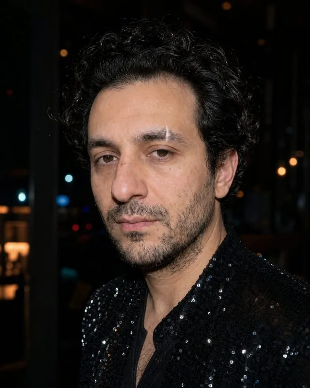 New Year's Eve: in a sequinned outfit against a dark room with bokeh lights, on-camera flash and deep shadows