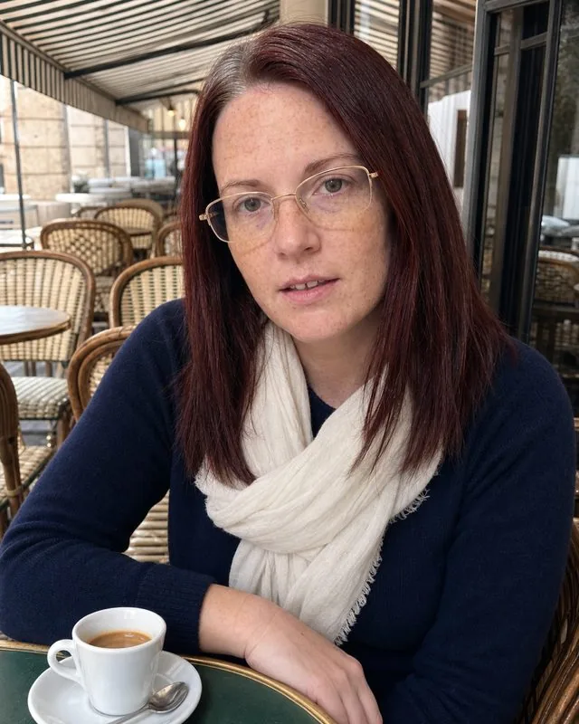 Paris: at a pavement cafe table with a small espresso, navy jumper and a light scarf