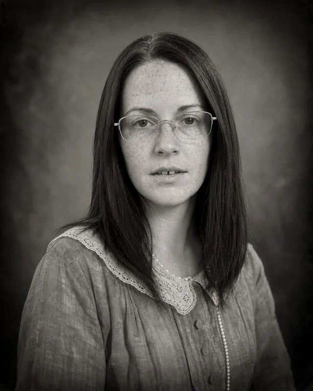 Silent film: a 1920s styled black and white portrait with heavy vignette and soft focus, period clothing